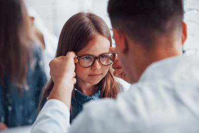Young girl with glasses wearing Eyezen Kids